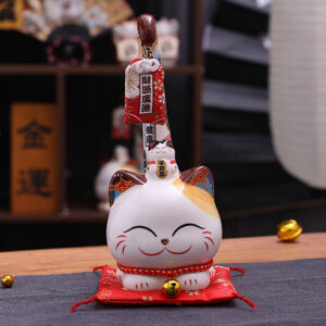 Front view of Japanese style white Lucky Cat. It is a decoration for indoor.