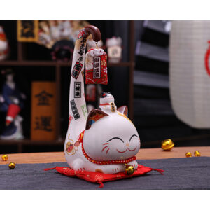Side view of Japanese style white Lucky Cat. It is a decoration for indoor.