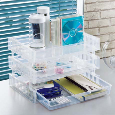 3 Japan Made transparent plastic stackable bins with various items and stationerys.