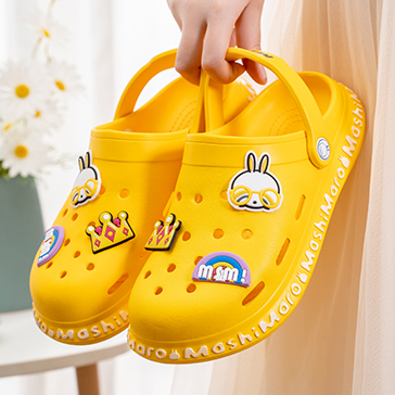 A pair of Mashi Maro yellow slipper.