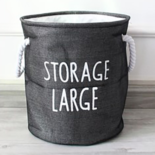 A black laundry basket with text "Storage large."