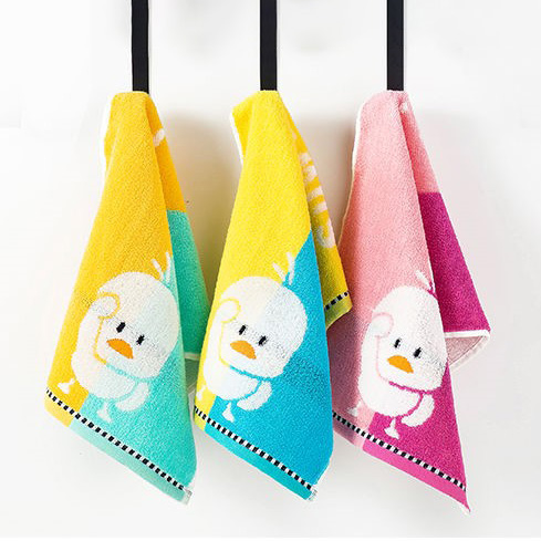 A set of towels with a cartoon chicken.
