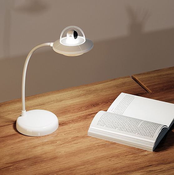 A white table lamp with UFO designed decoration.
