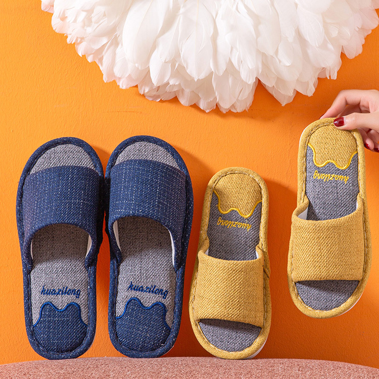 2 pairs of huazilong comfortable slippers. The blue slipper is on the left of the image, and the yellow slipper is on the right of the image. On the slipper, there is a "huazilong " text.