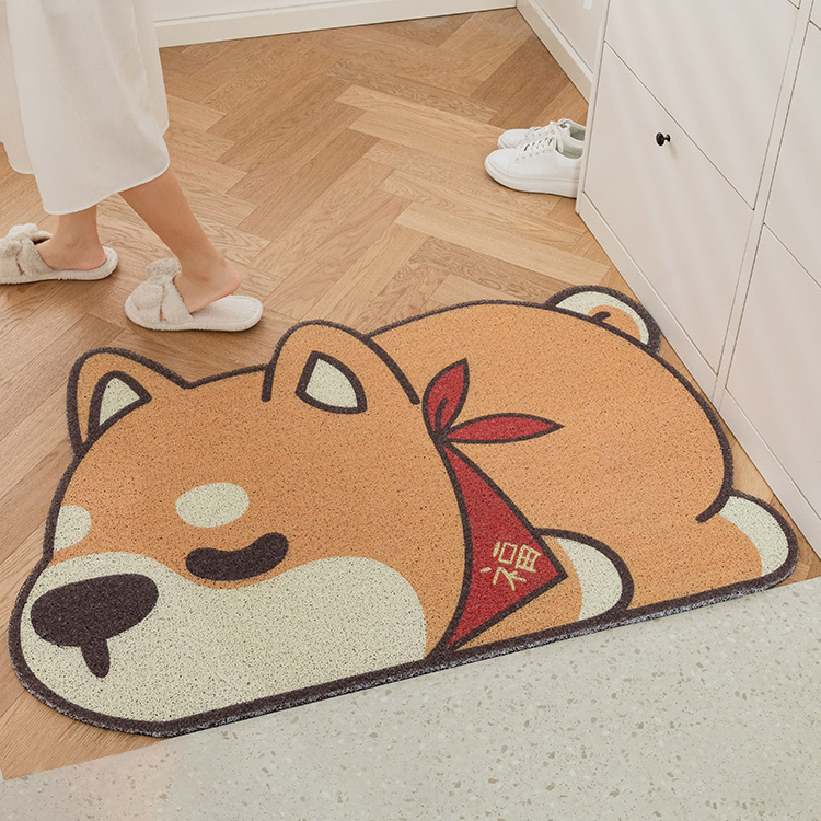 A carpet with pattern of a cute cartoon sleeping shiba dog on the floor. With the text "fuk" on the blanket. This is an image of showing one's better living product.