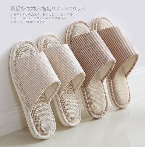 two pairs of Comfort Indoor Slippers. They are white and light brown.