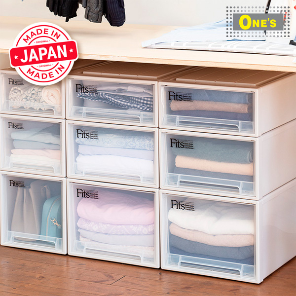 A Tenma Japanese made closet with clothes and a drawer full of clothes.