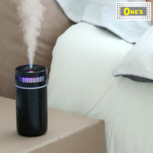 A Car Humidifiers in black and next to the bed.