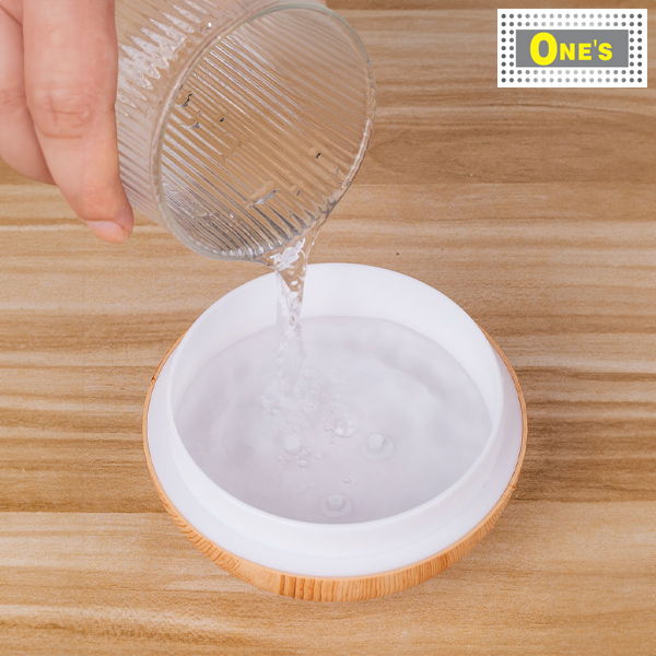 Adding water to a humidifier.